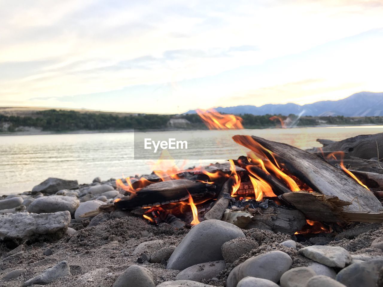 Close-up of bonfire at sunset