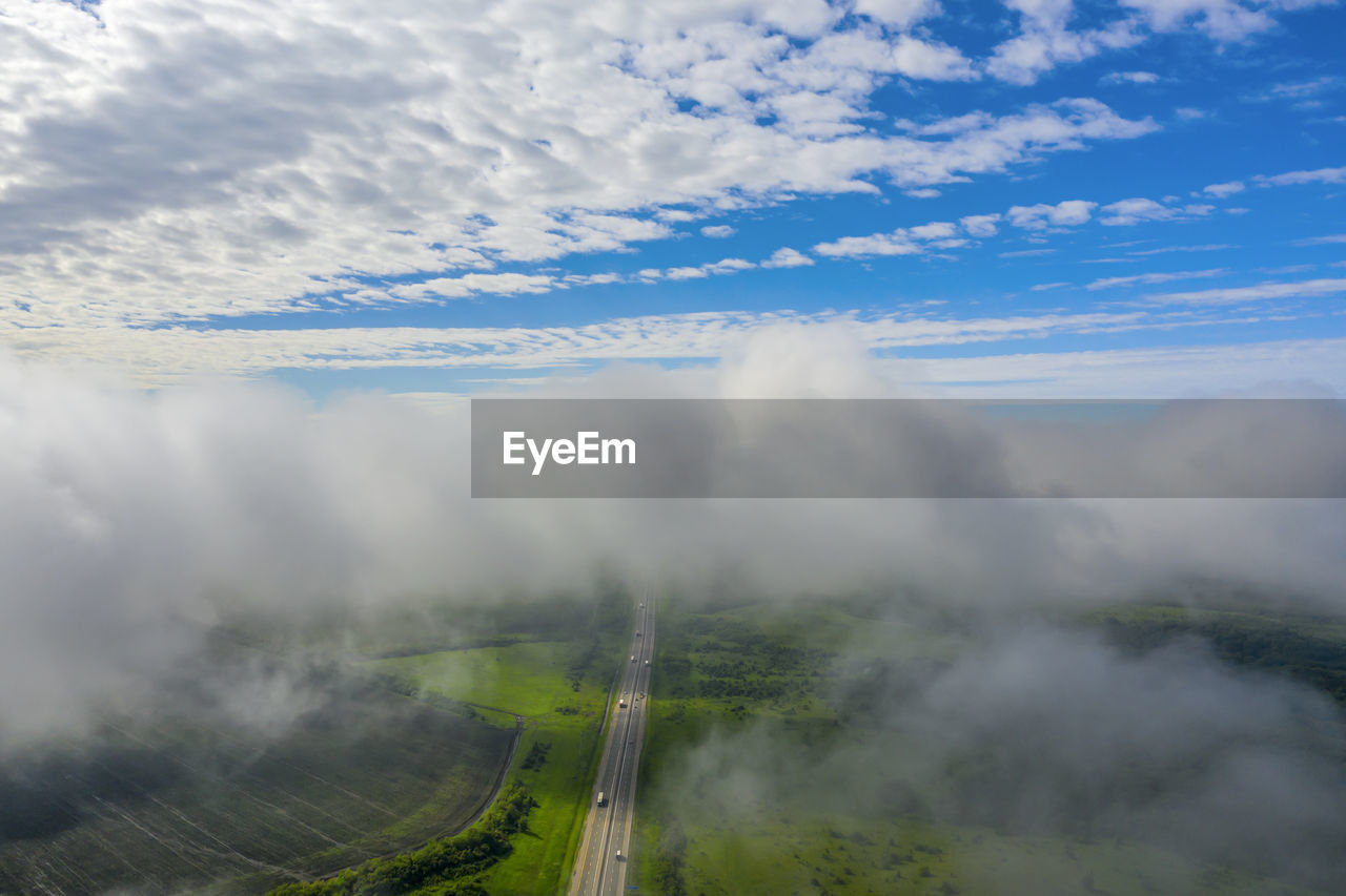 AERIAL VIEW OF RAILROAD TRACKS AGAINST SKY