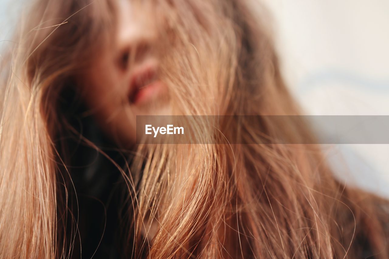 Close-up of woman with tousled hair