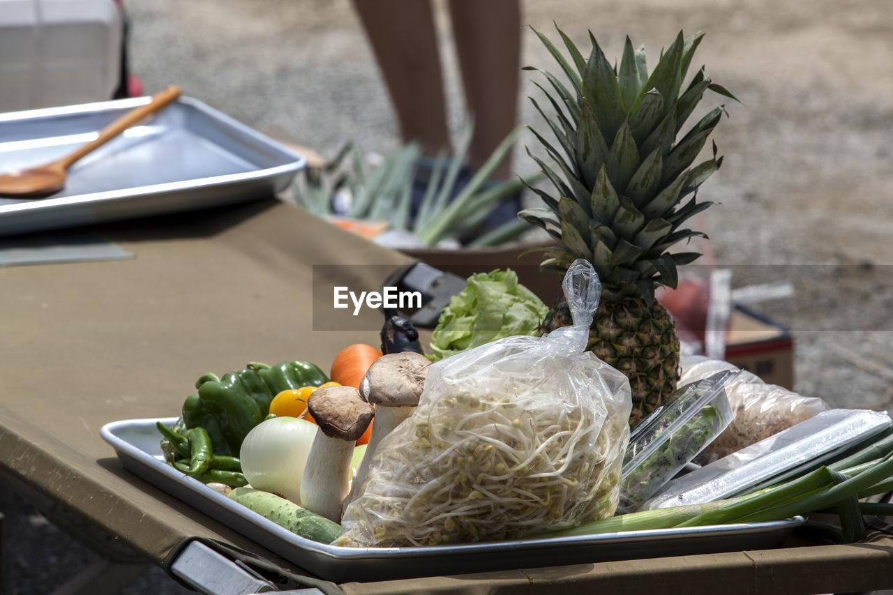 High angle view of vegetables with pineapple on table