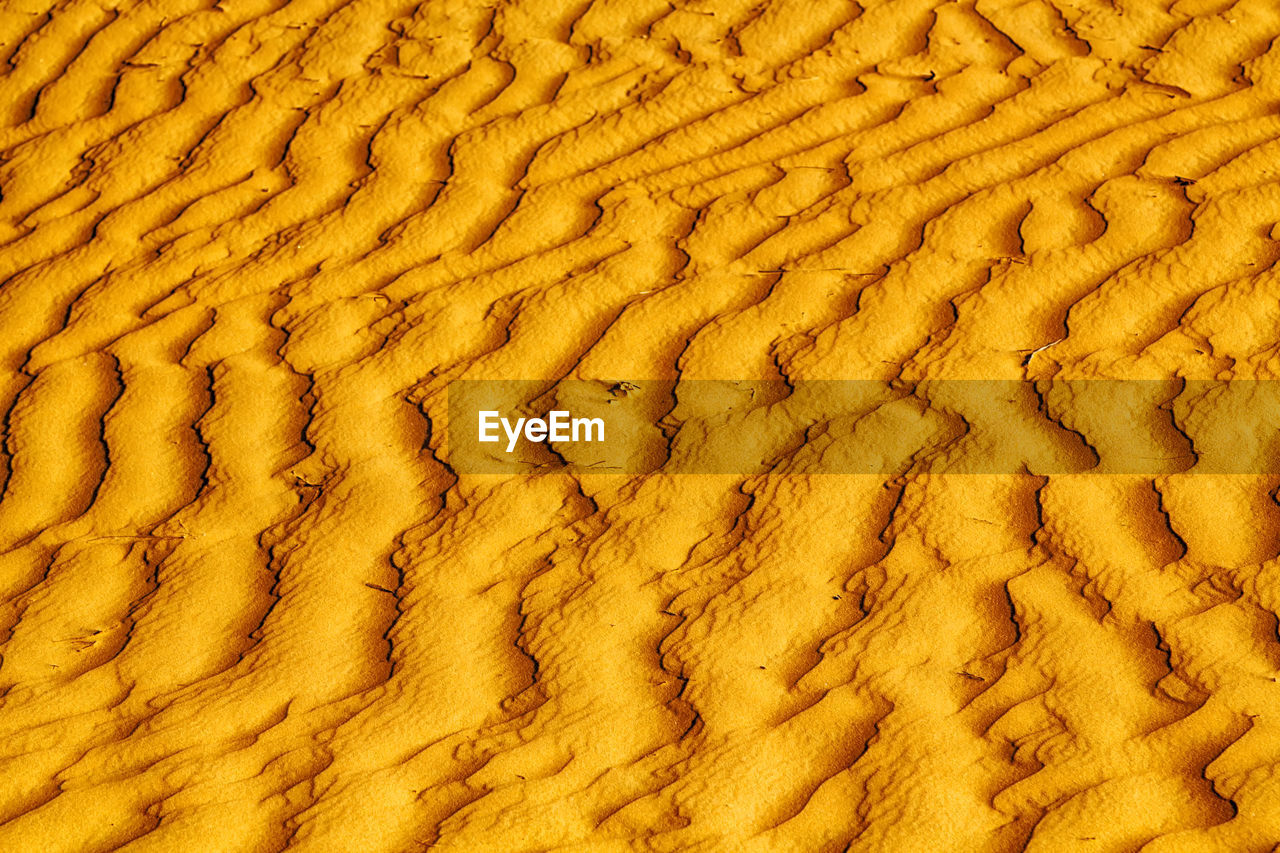 FULL FRAME SHOT OF YELLOW SAND