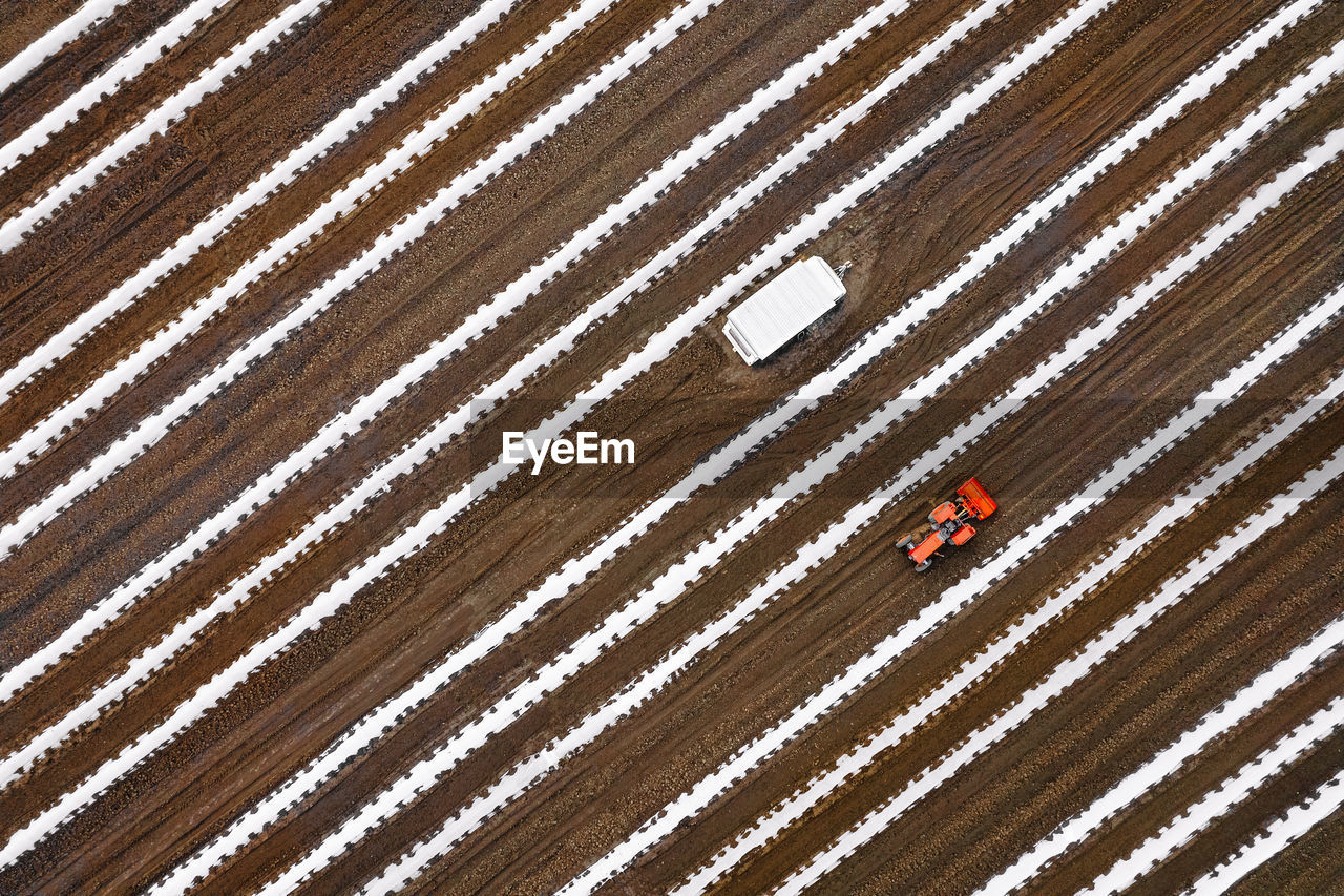 Aerial view of cultivated agricultural field in spring