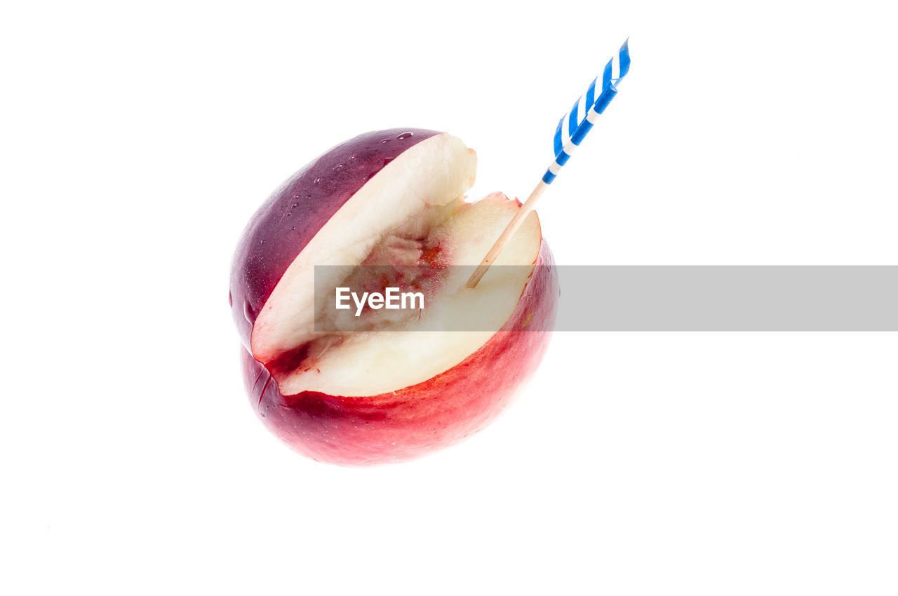 CLOSE-UP OF FRUITS OVER WHITE BACKGROUND