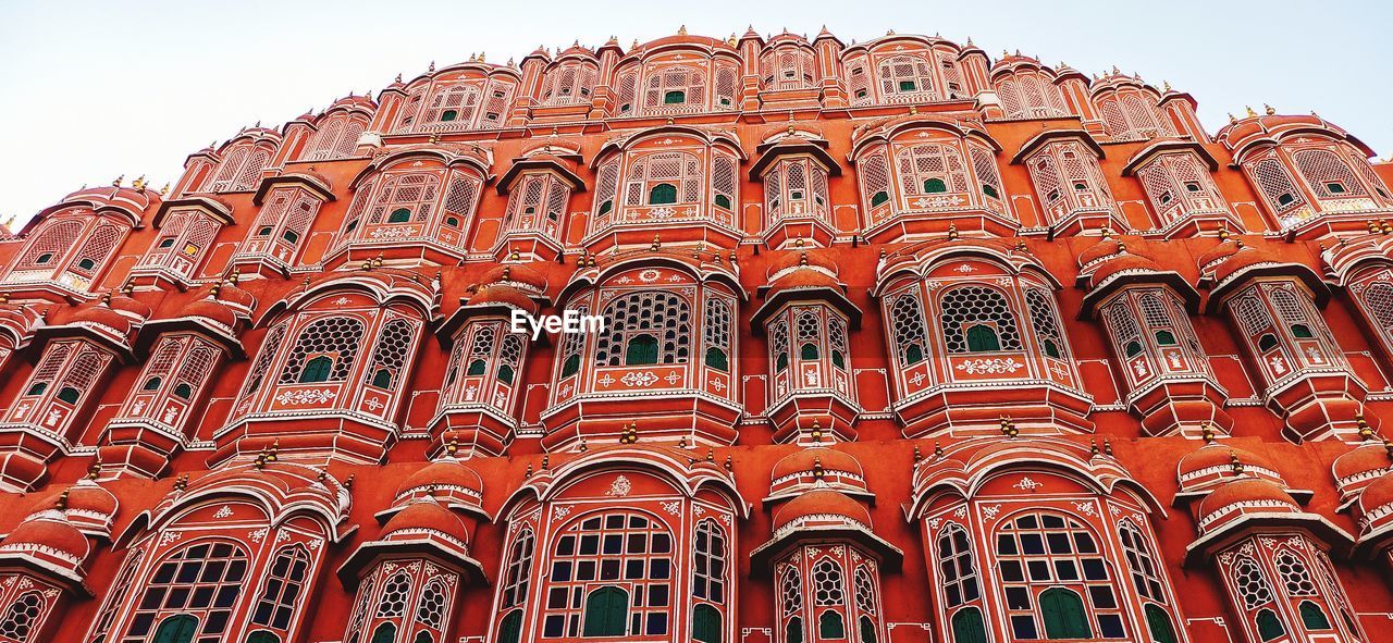 architecture, built structure, building exterior, low angle view, travel destinations, landmark, facade, arch, building, history, the past, sky, no people, travel, tourism, city, red, day, nature, religion, outdoors, place of worship, window, belief, clear sky