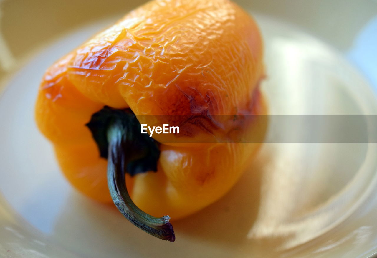 High angle view of baked pepper in plate on table