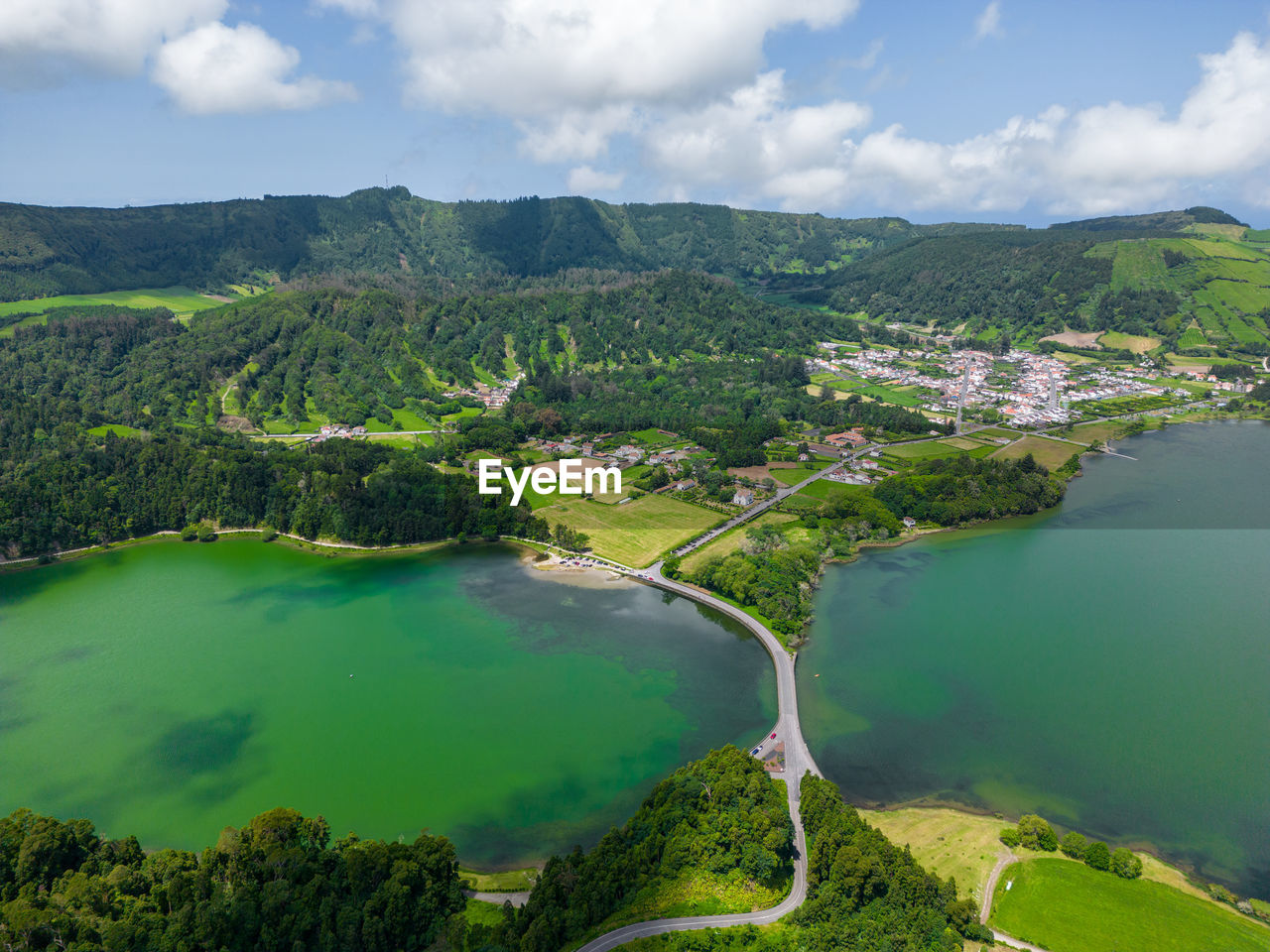 high angle view of river amidst mountains against sky