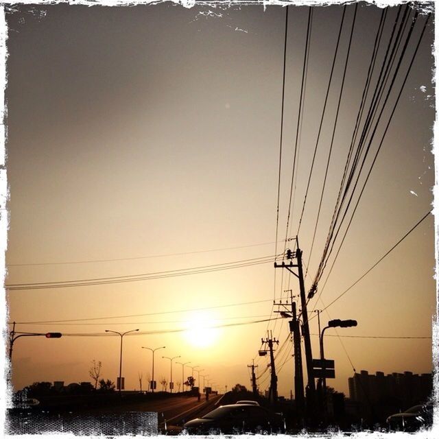 ELECTRICITY PYLONS AT SUNSET