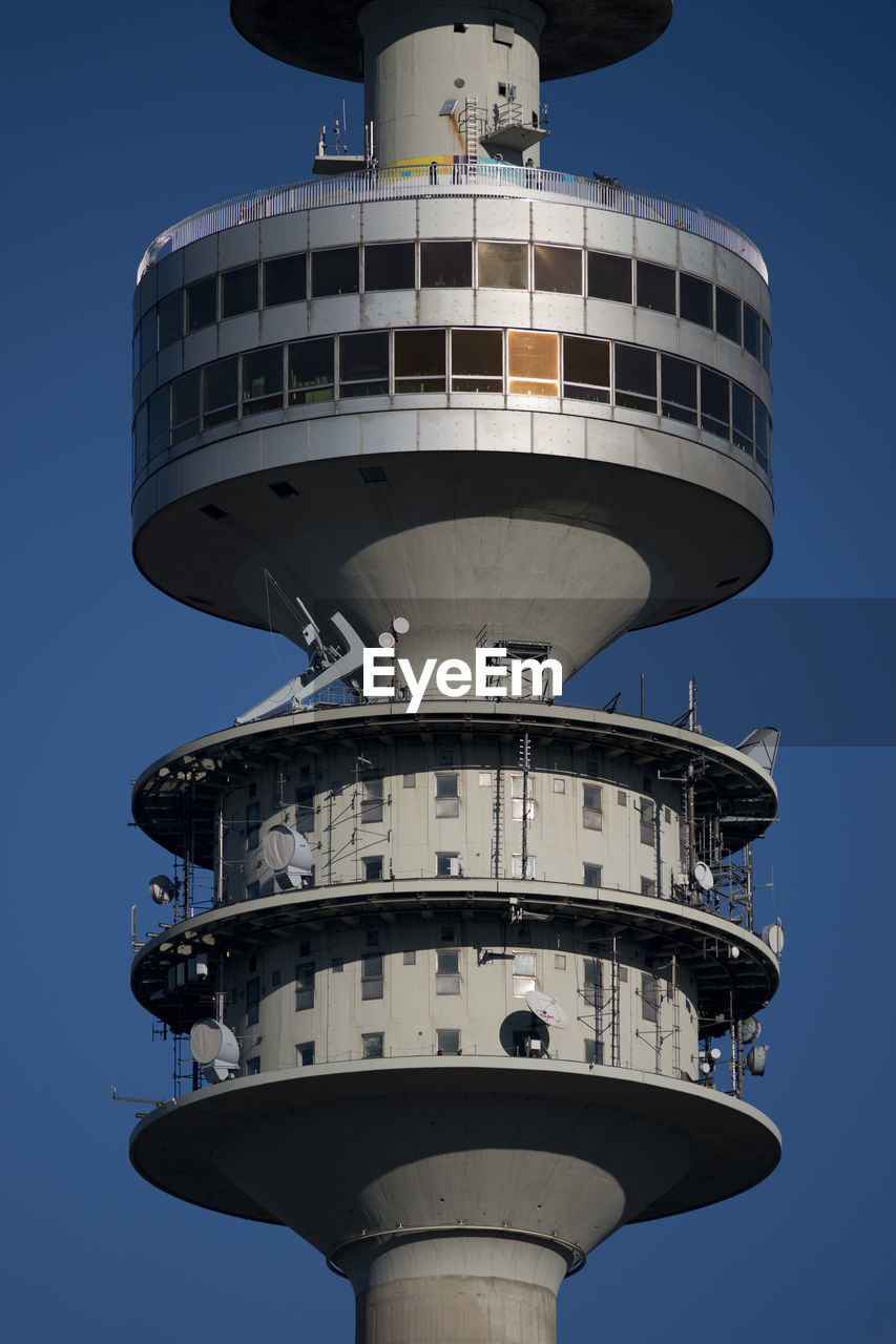 LOW ANGLE VIEW OF WATER TOWER AGAINST BLUE SKY