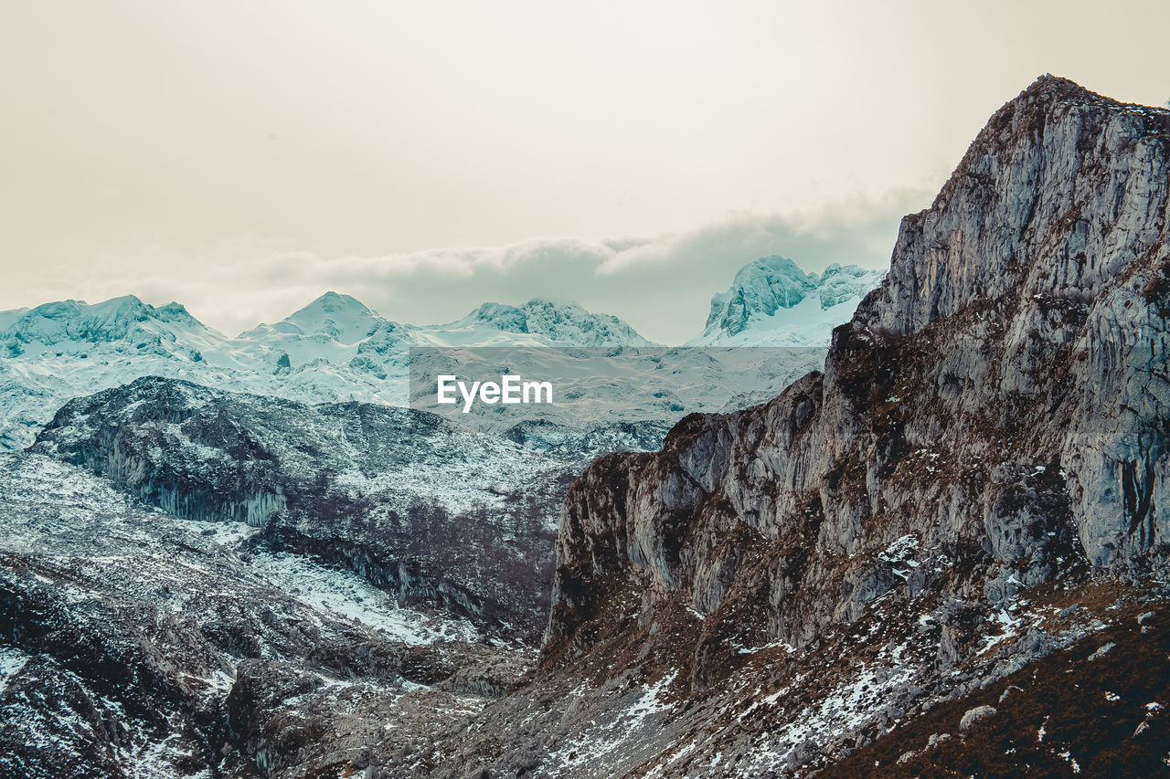 Scenic view of snowcapped mountains against sky