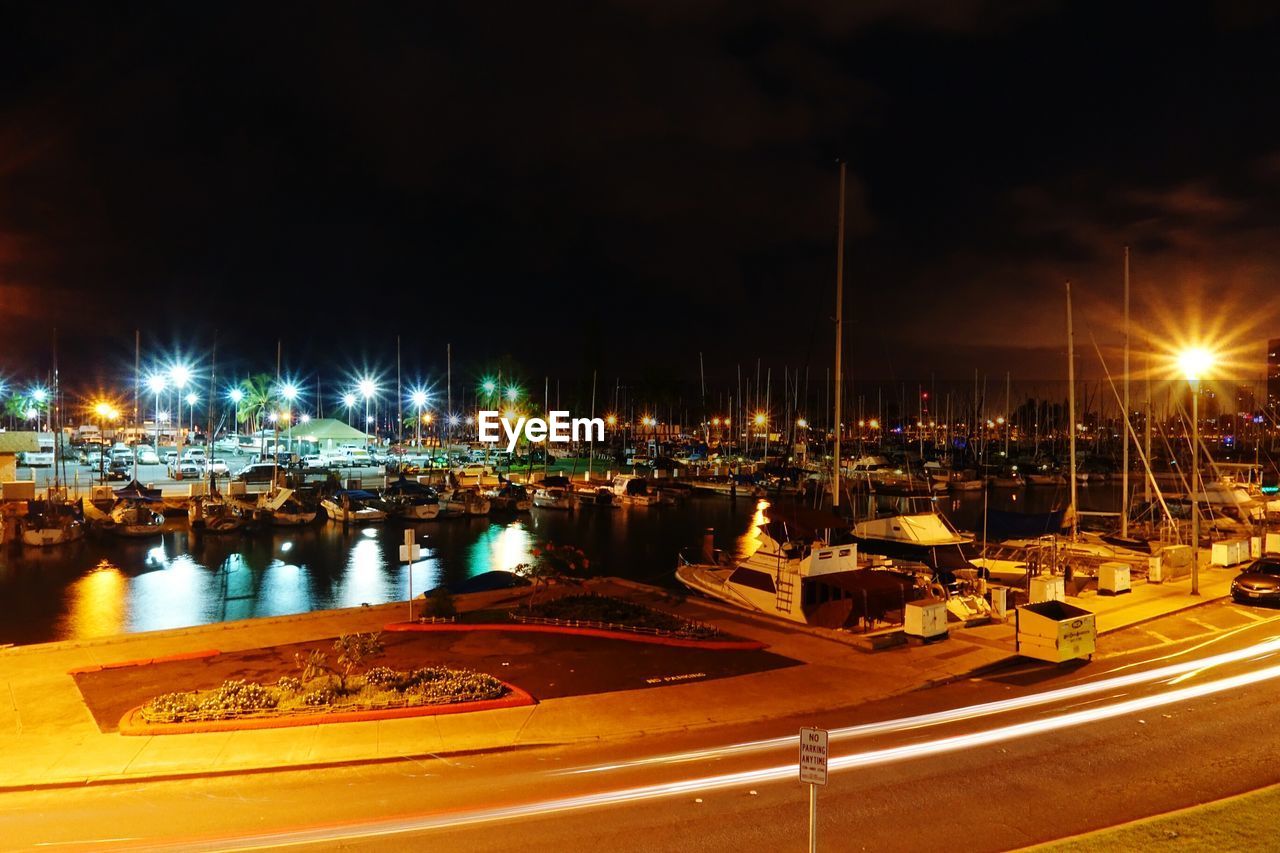 Boats moored at harbor