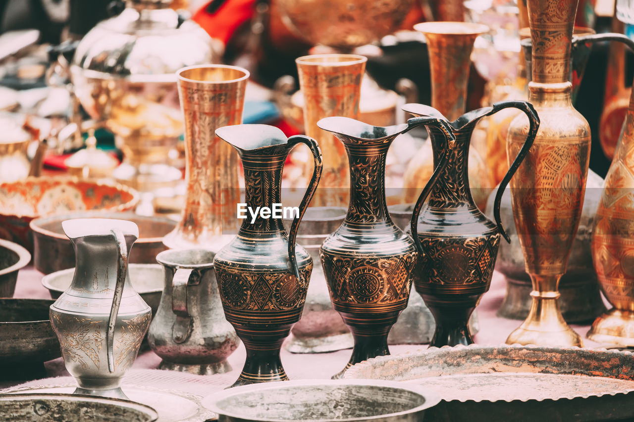 Various container displayed for sale at market stall