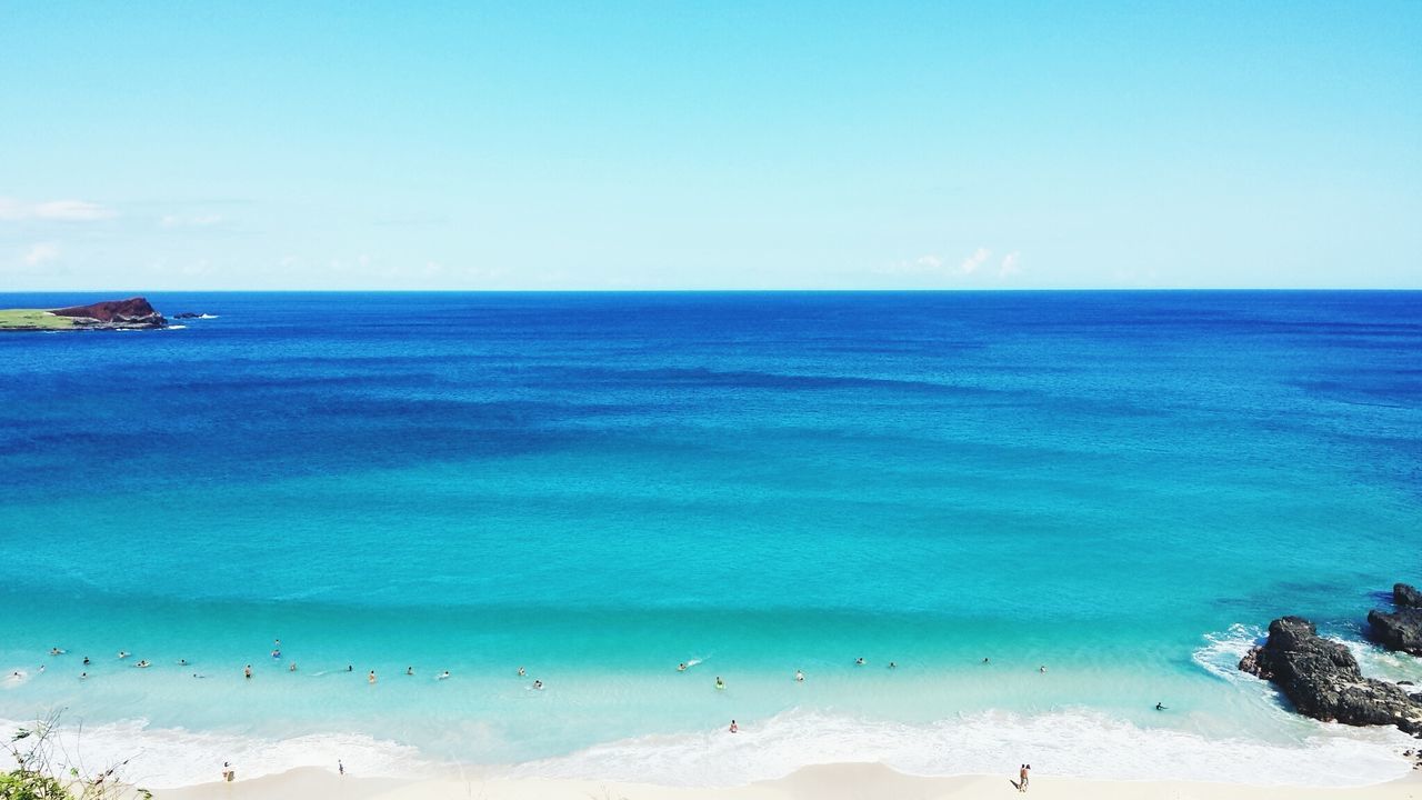 Scenic view of sea against blue sky