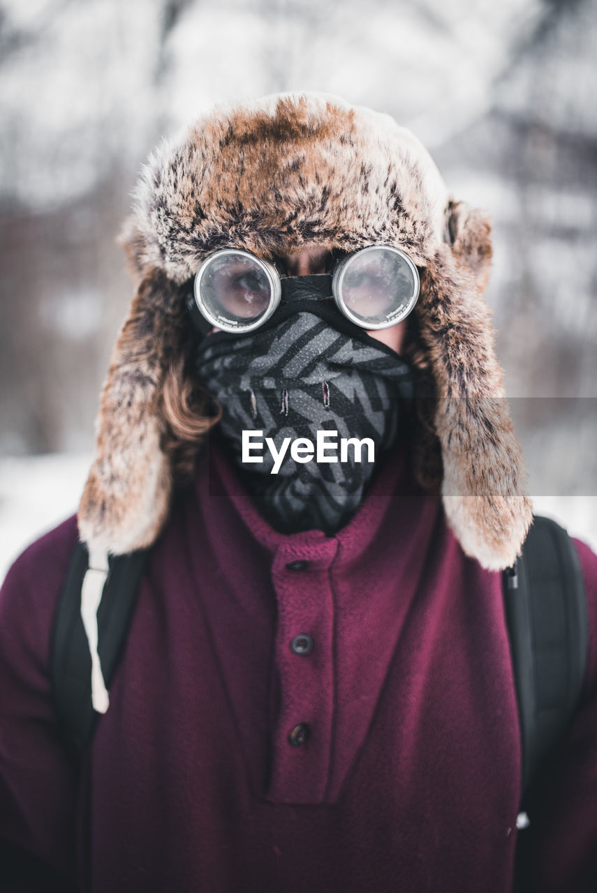 CLOSE-UP PORTRAIT OF MAN WITH SNOW