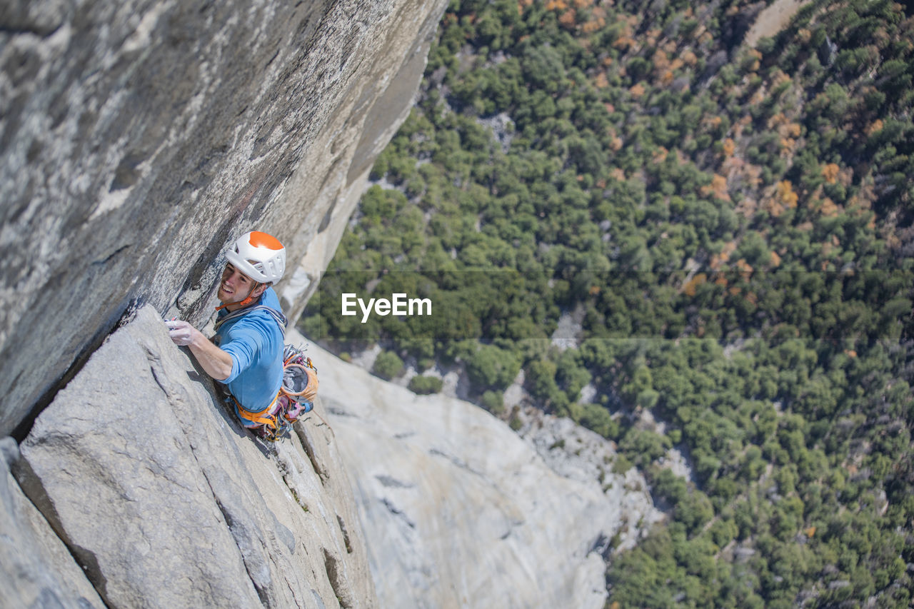 Rock climber climbing at top of el capitan very exposed on the nose