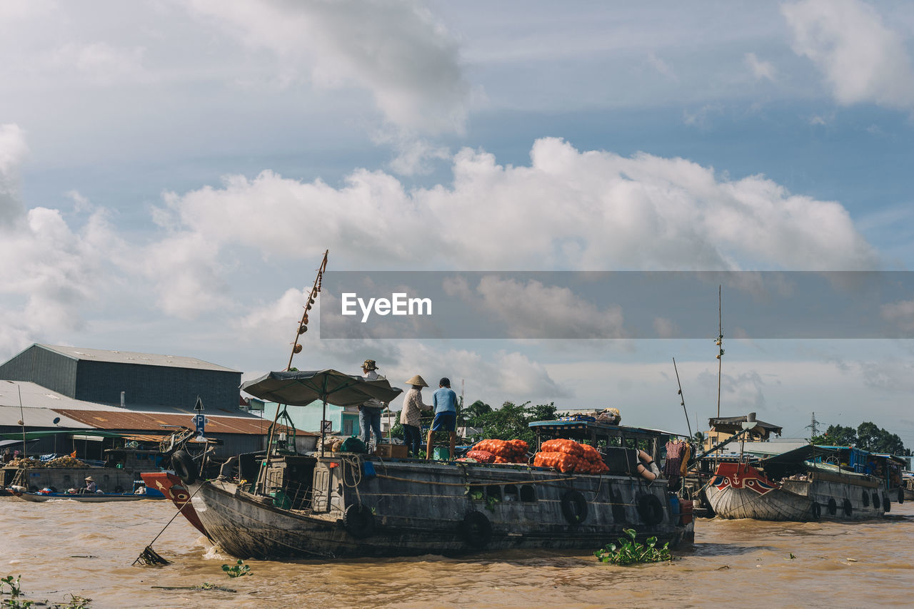 FISHING BOATS MOORED AT HARBOR