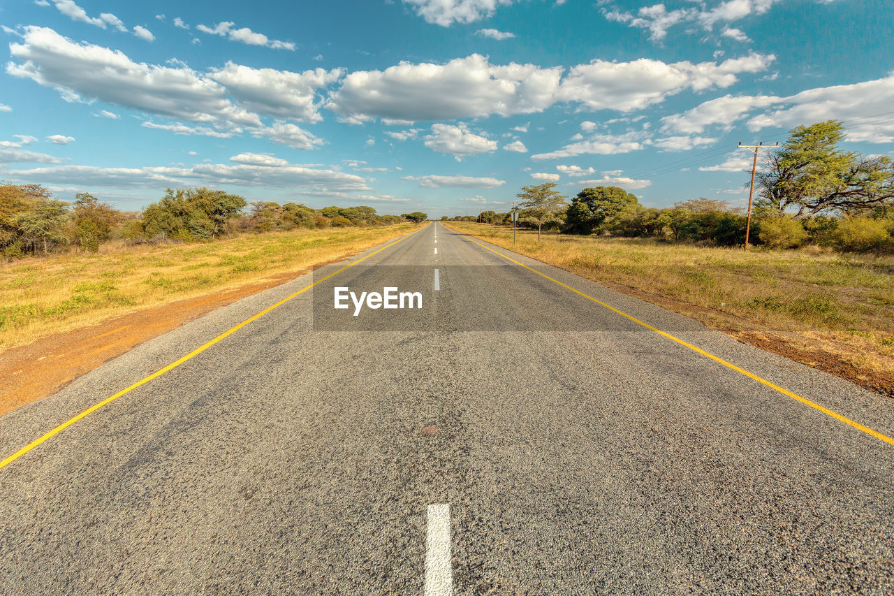 ROAD BY LAND AGAINST SKY