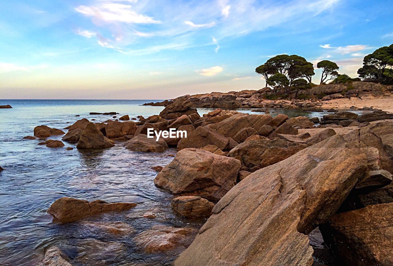 Scenic view of sea against cloudy sky