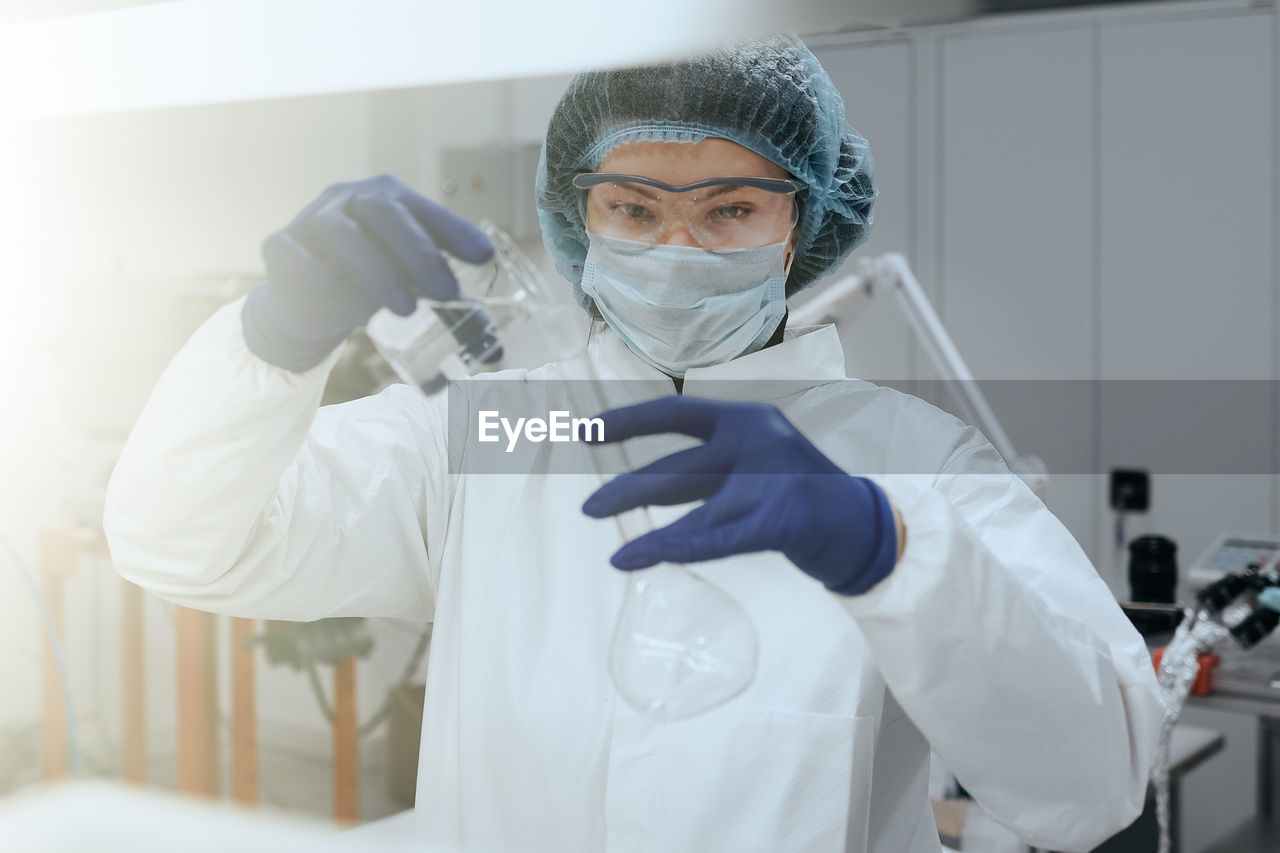 portrait of female doctor examining patient