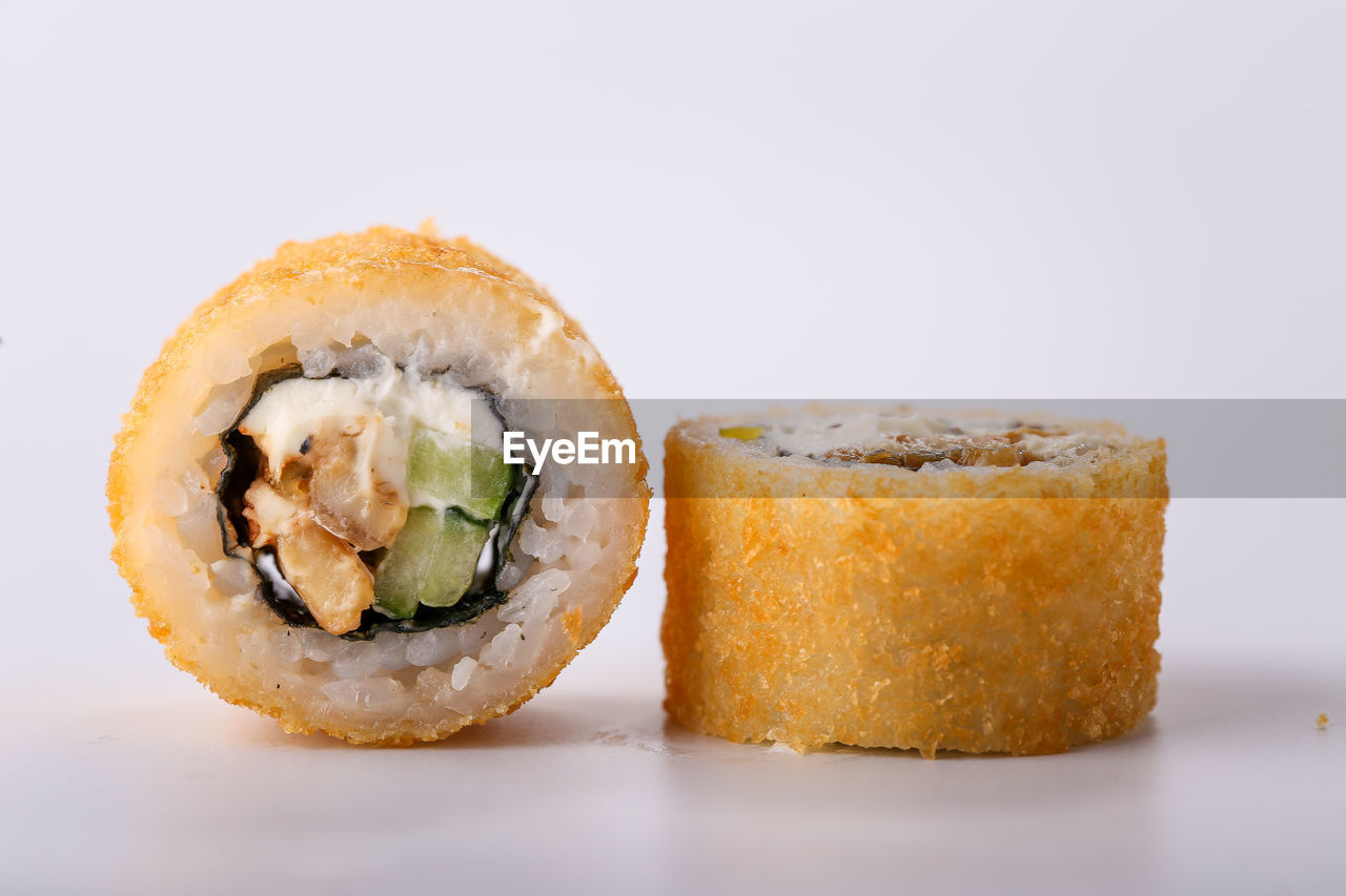 CLOSE-UP OF SUSHI SERVED IN PLATE