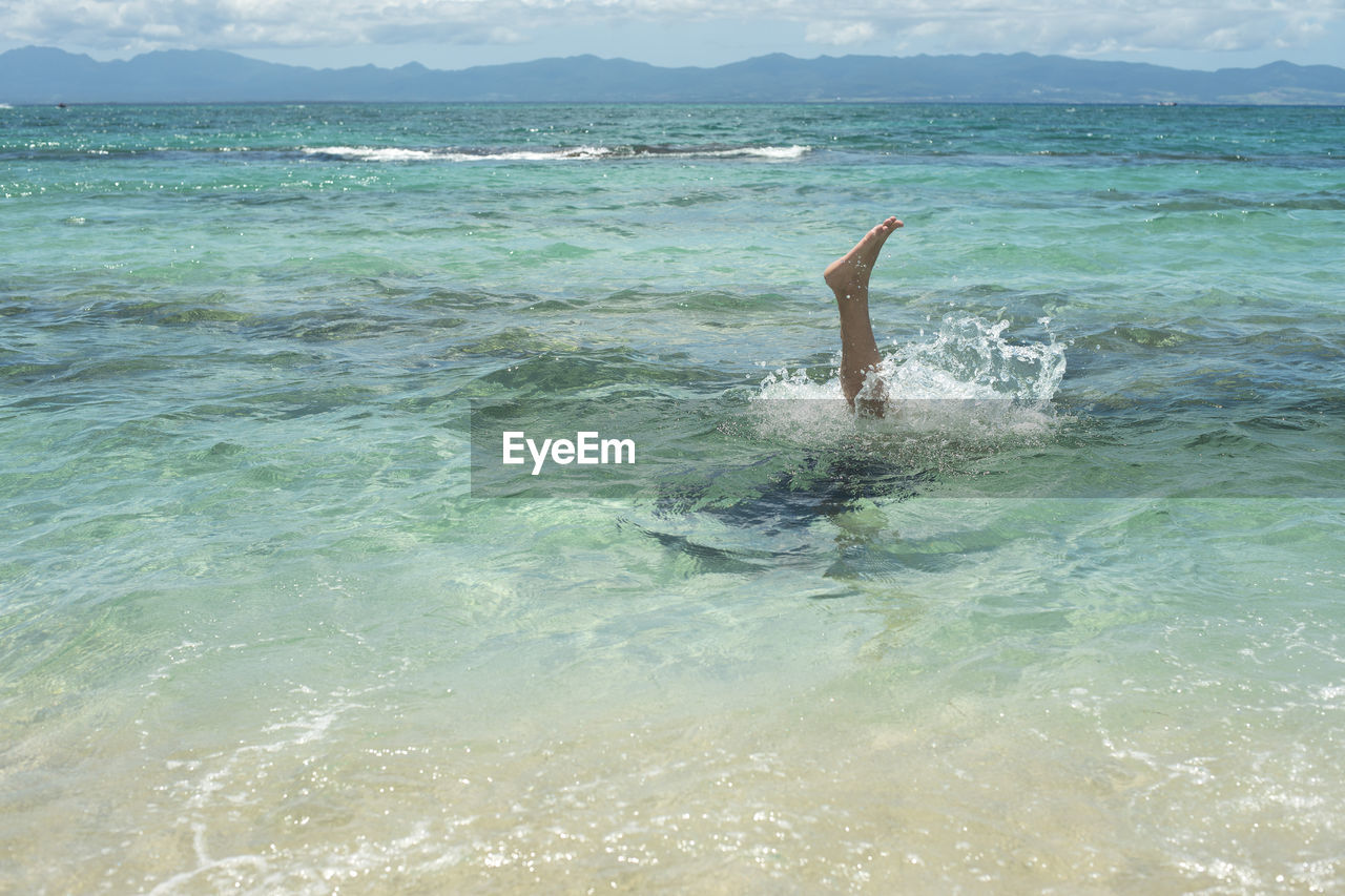 MAN SWIMMING IN WATER