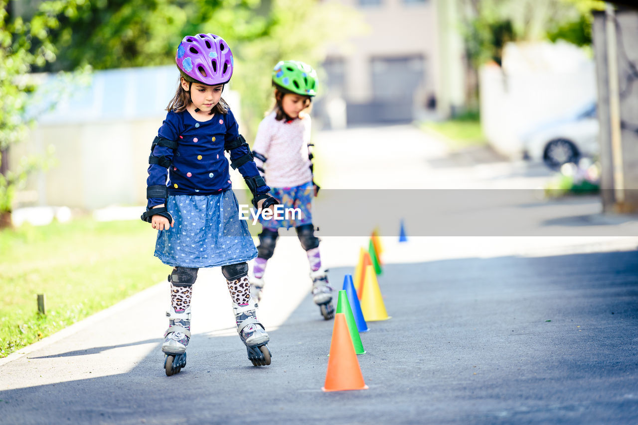 Girls skating on road