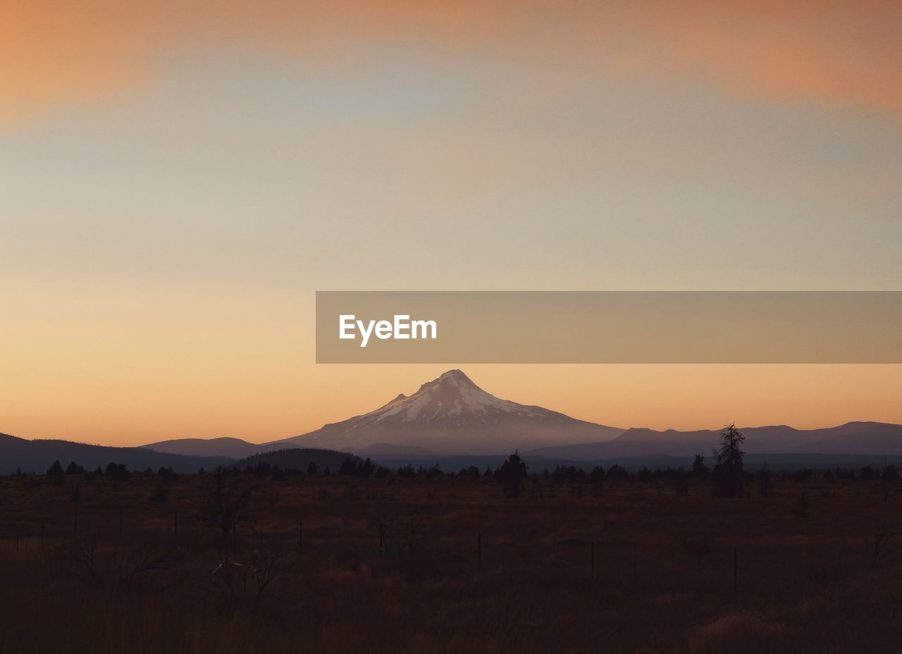 Scenic view of silhouette mountains against sky