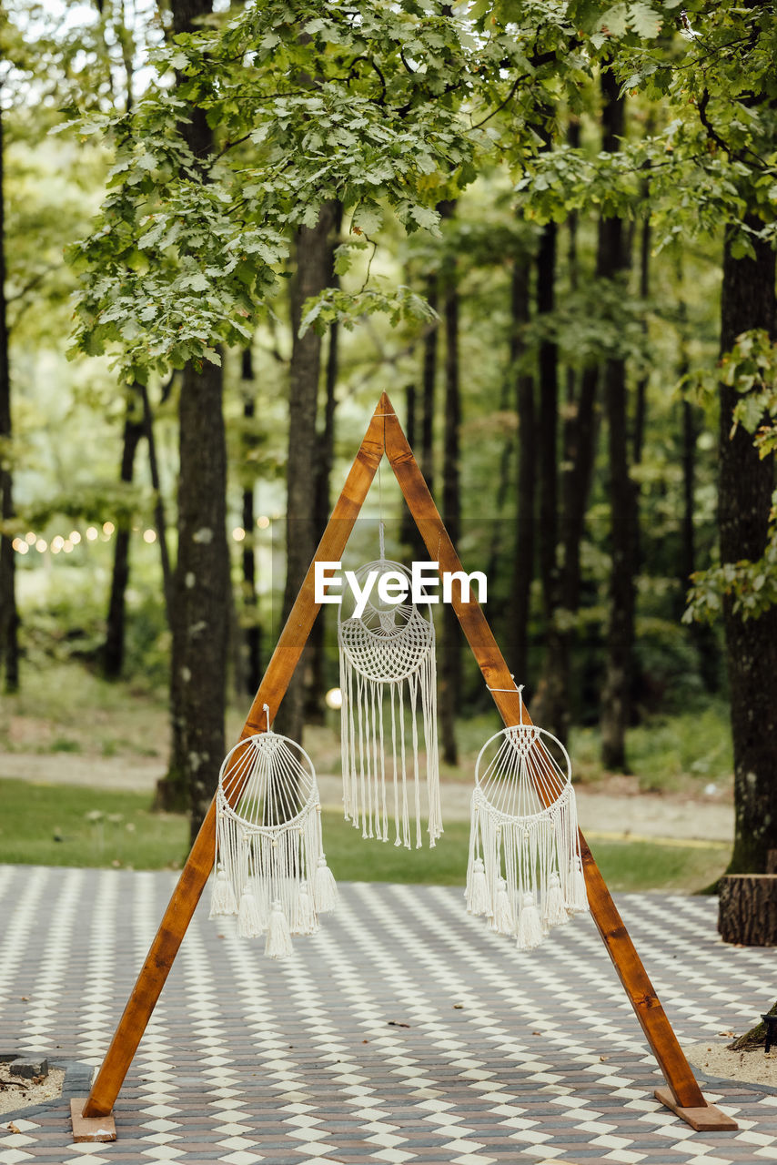 Green boho background dreamcatcher in the forest
