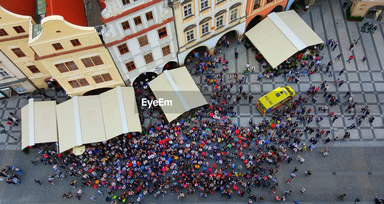 HIGH ANGLE VIEW OF PEOPLE IN CITY AT NIGHT