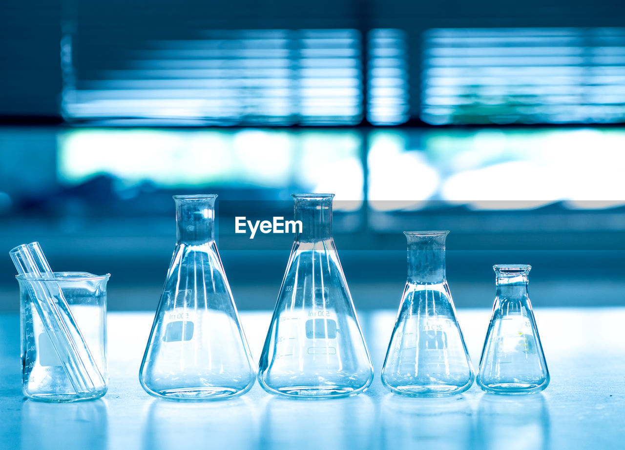 Close-up of laboratory glassware on table