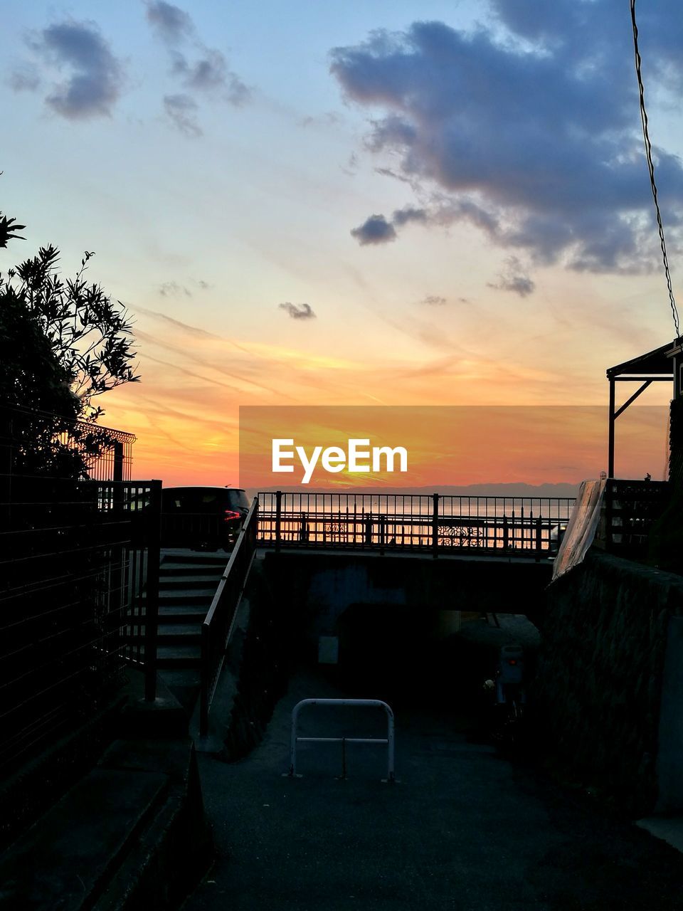 Scenic view of silhouette beach against sky during sunset