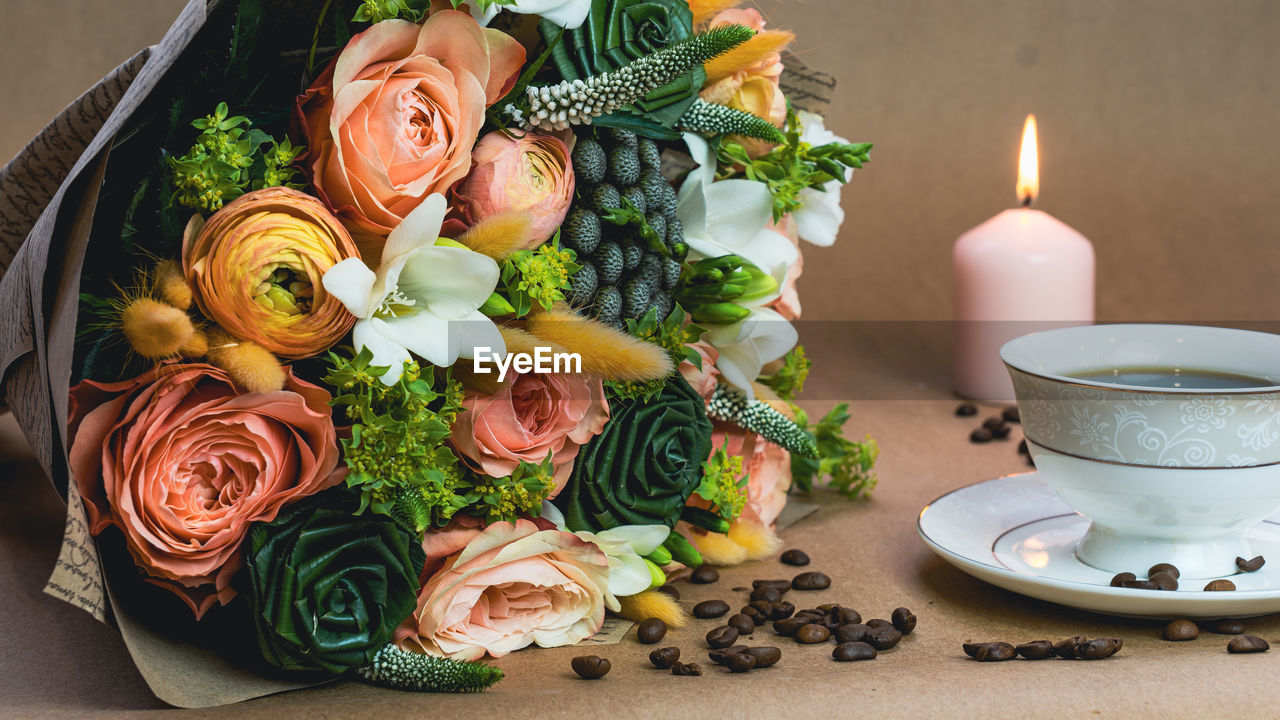 CLOSE-UP OF ROSES ON TABLE