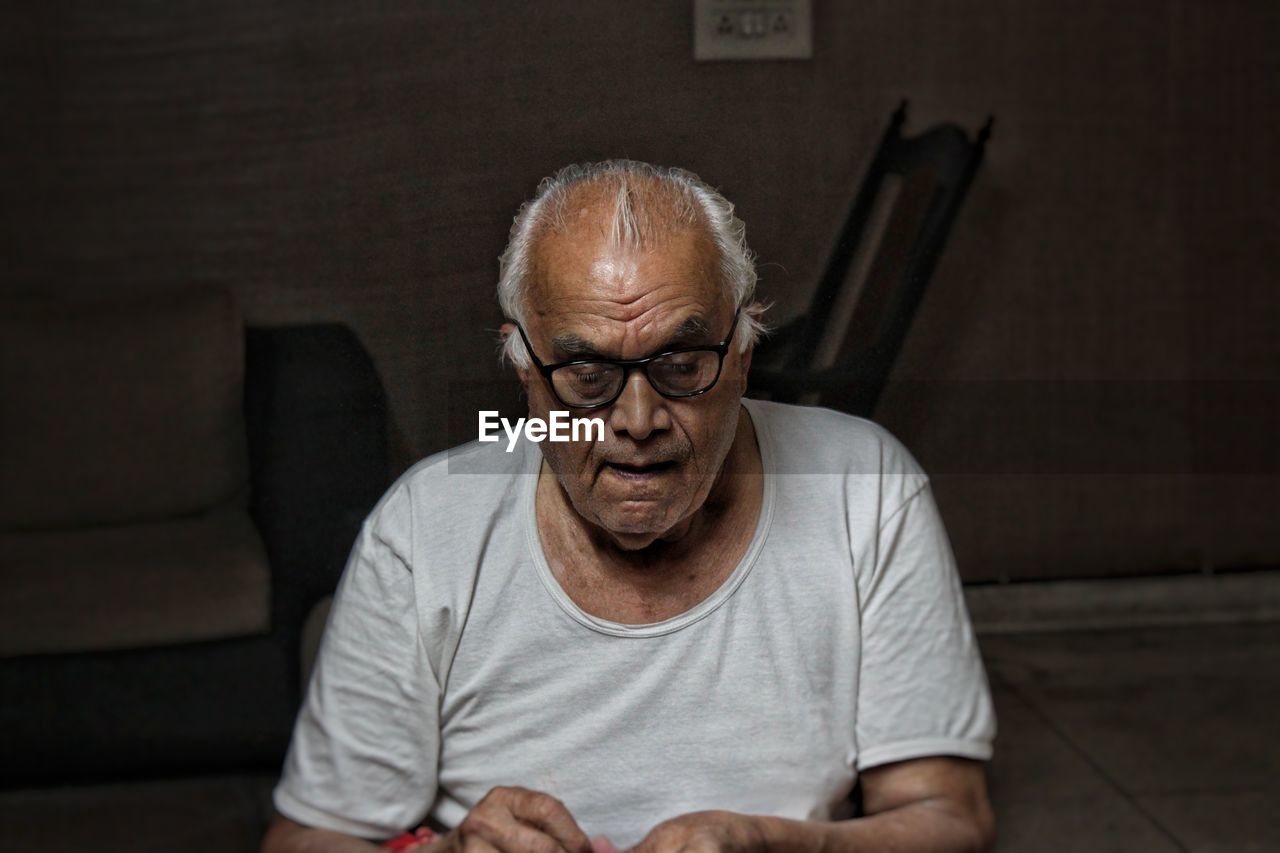 Portrait of man sitting at home