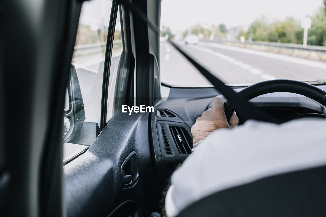 Close-up of man driving car