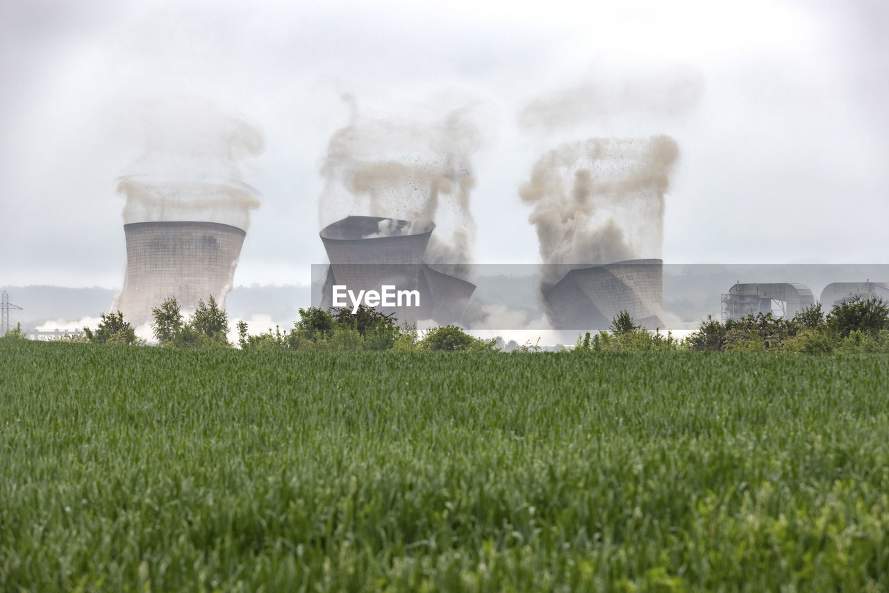 Uk, england, rugeley, cooling towers falling down during demolishing process