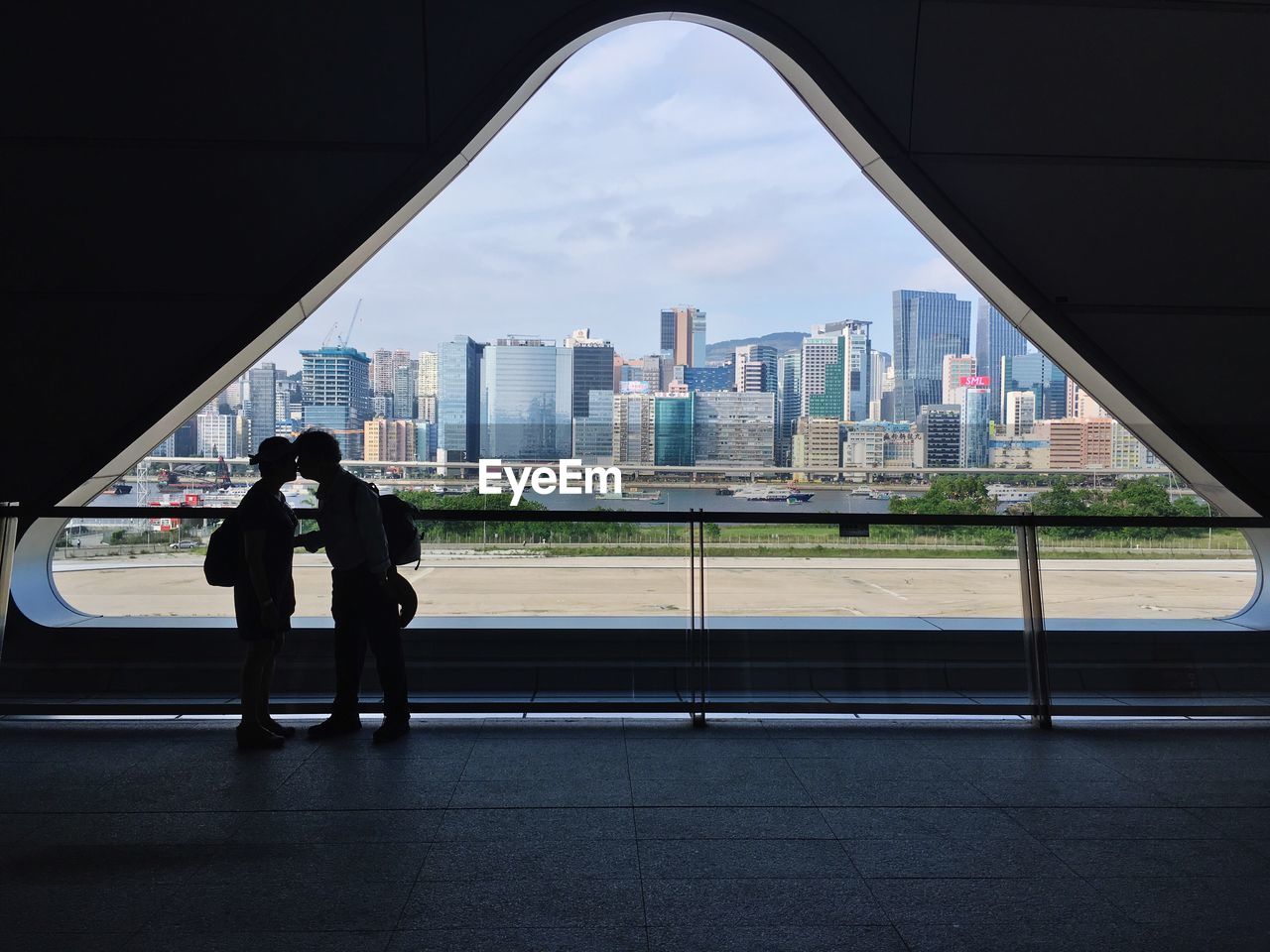 Full length of man and woman standing in city