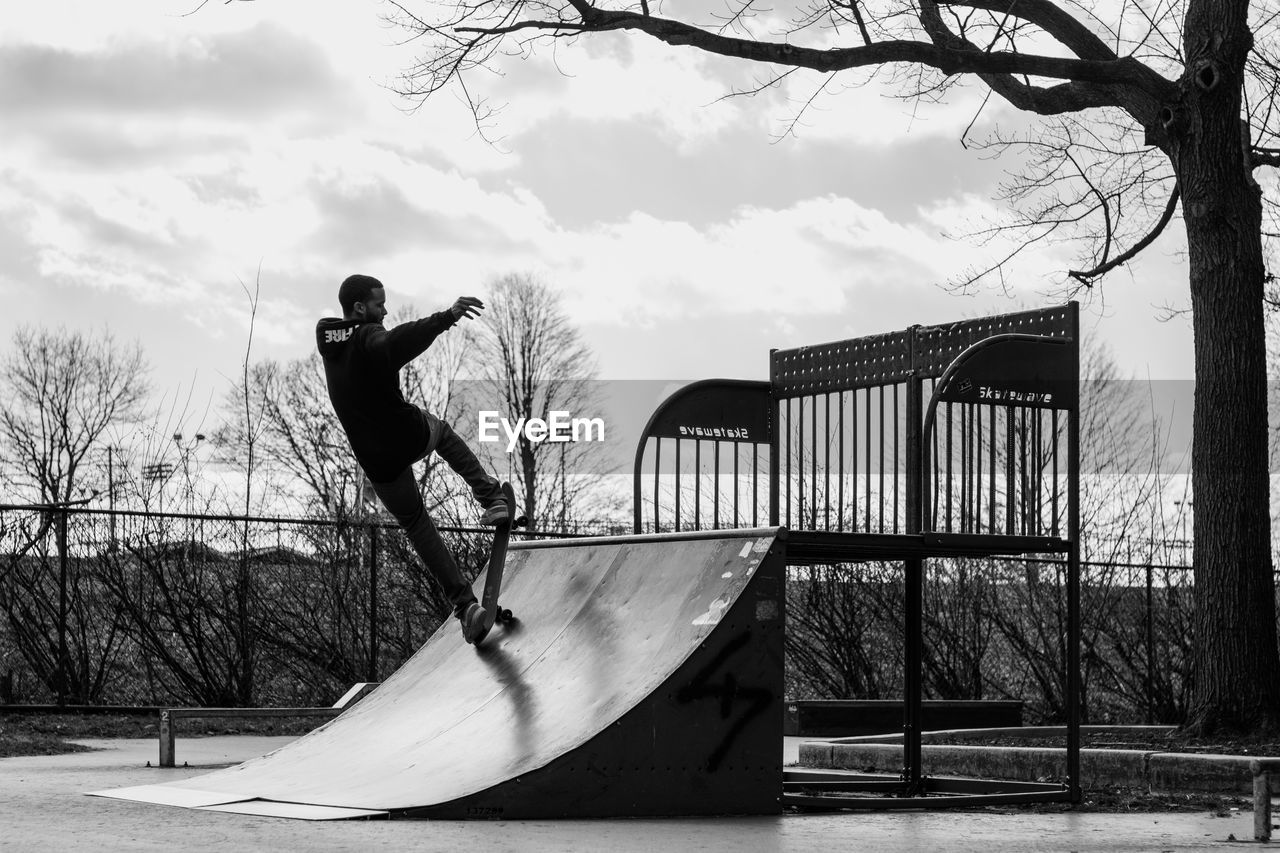 MAN JUMPING AGAINST BUILT STRUCTURE