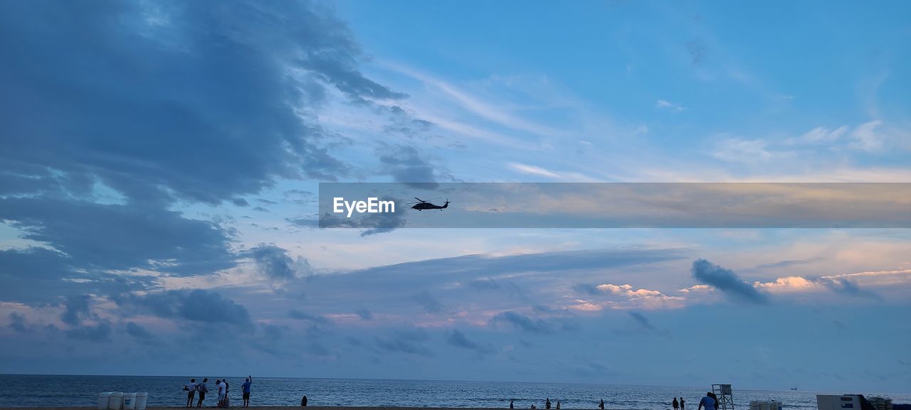 AIRPLANE FLYING OVER SEA