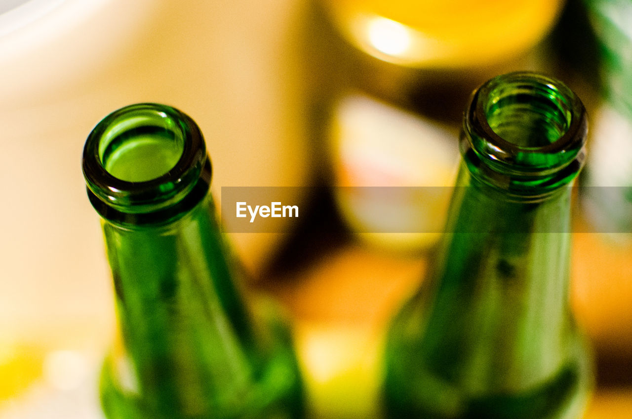 Close-up of beer bottles on table