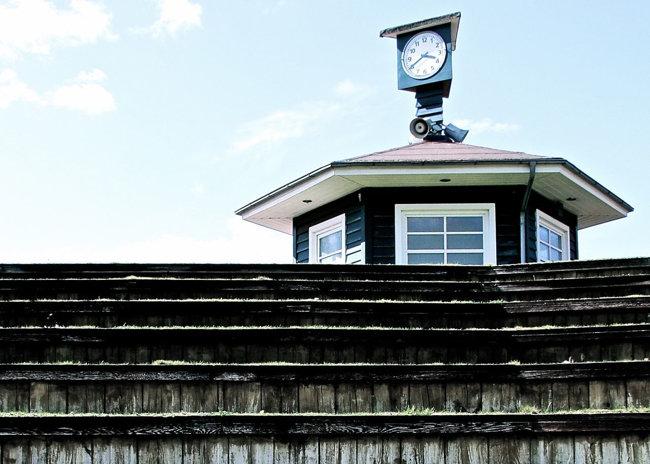 Low angle view of clock tower against sky