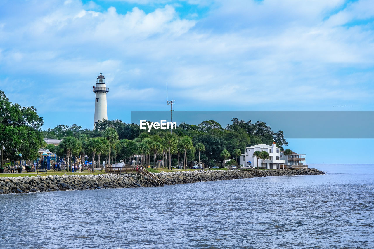 VIEW OF LIGHTHOUSE BY BUILDING