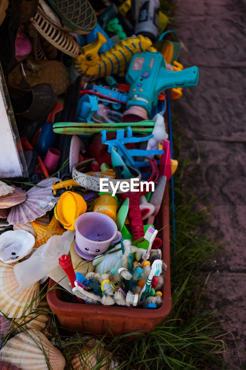 High angle view of abandoned toys on footpath