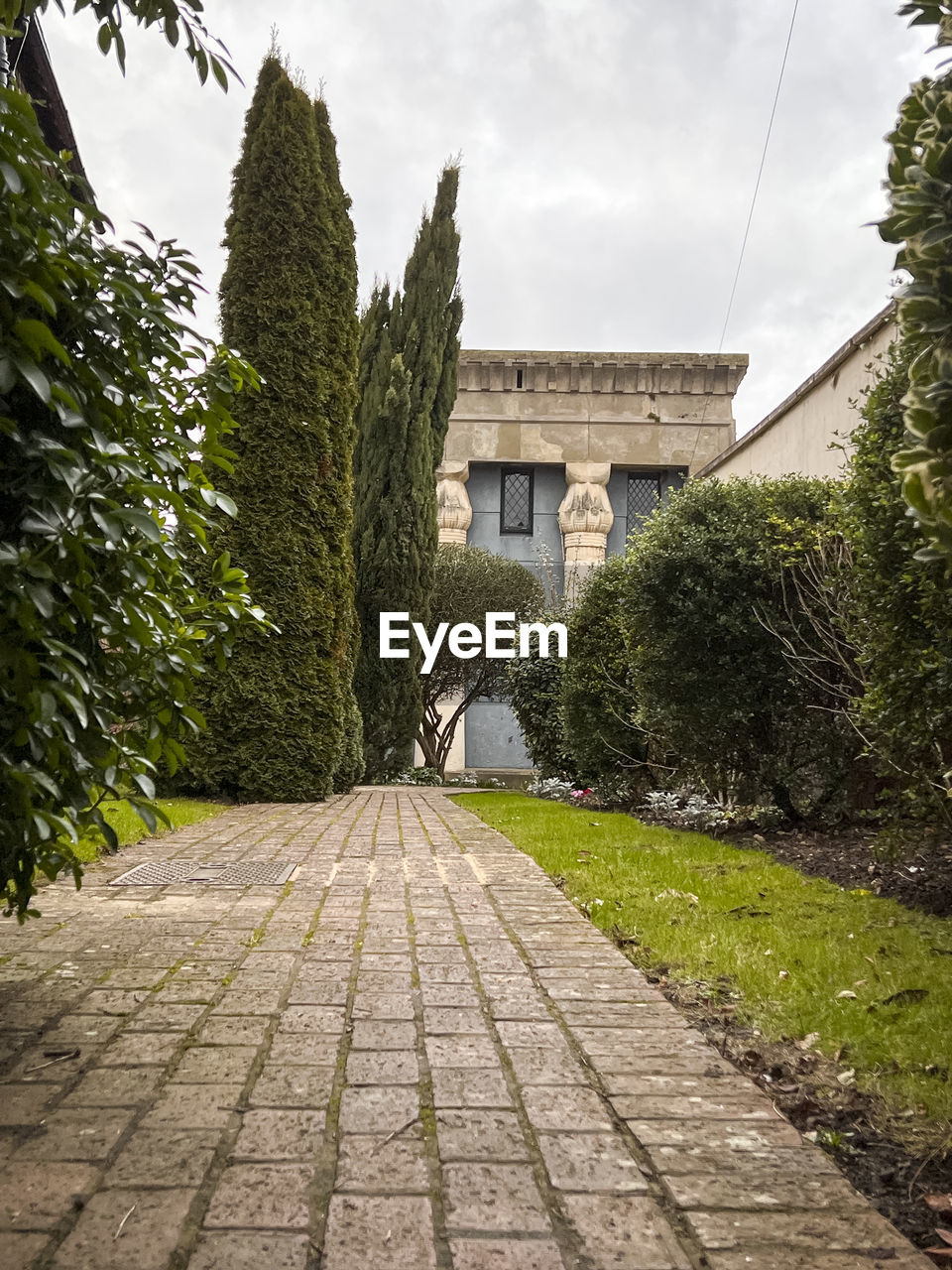 architecture, plant, built structure, tree, building exterior, footpath, nature, sky, building, garden, cloud, no people, the past, history, city, estate, travel destinations, house, outdoors, the way forward, street, day, cobblestone, residential district, mansion, travel, tourism