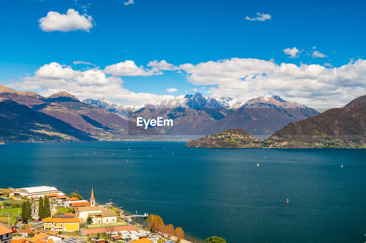 View of lake como, looking north, from musso, with alps, villages and the mountains of valtellina.