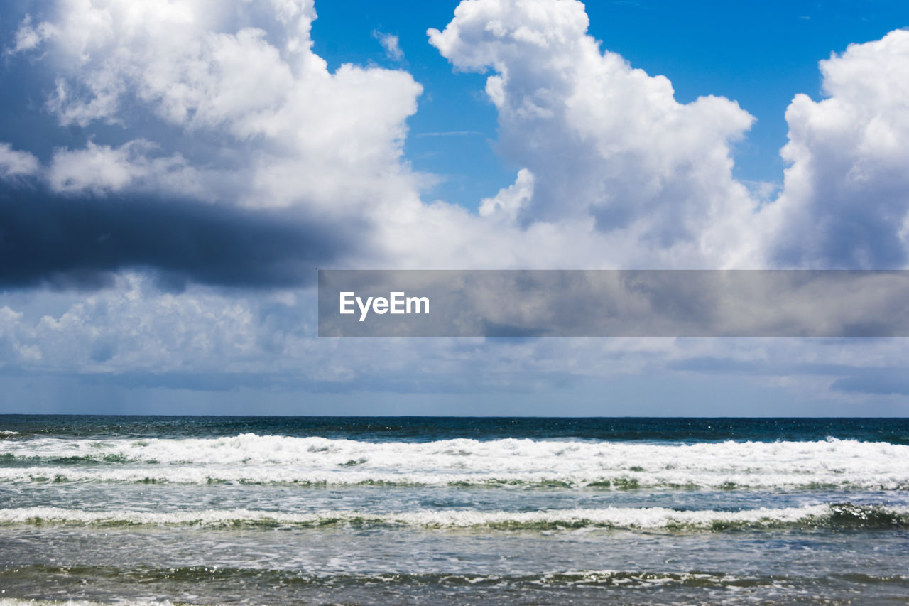 VIEW OF SEA AGAINST CLOUDY SKY