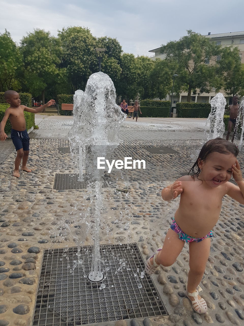 FULL LENGTH OF A BOY WITH FOUNTAIN