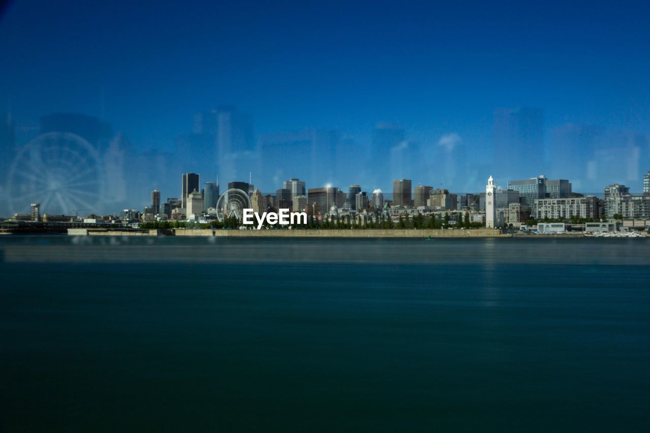 CITY BUILDINGS AT WATERFRONT