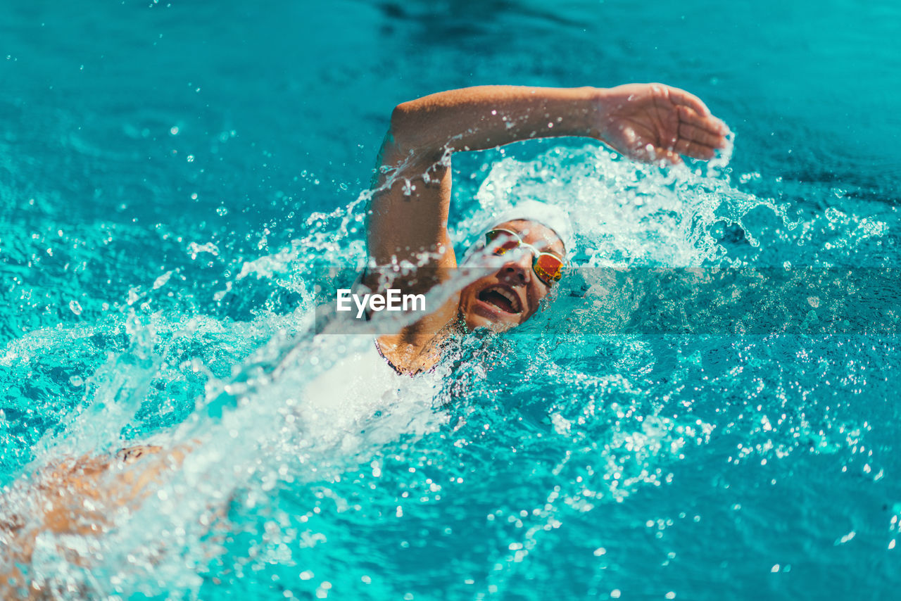 Female athlete swimming in pool