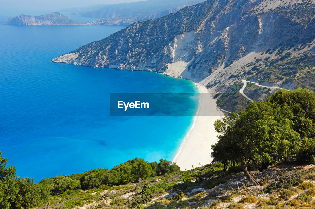 HIGH ANGLE VIEW OF BAY AGAINST CLEAR SKY