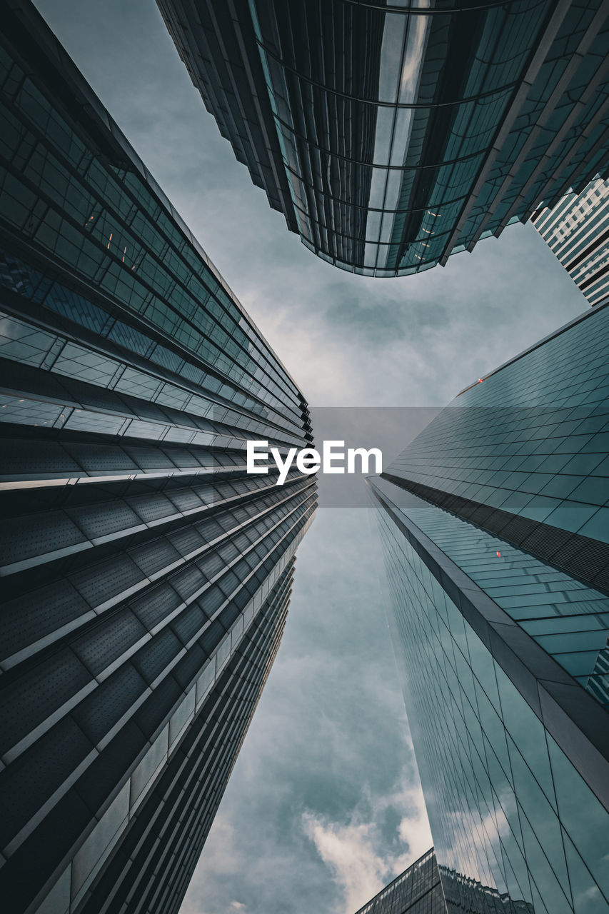 Low angle view of modern buildings against sky