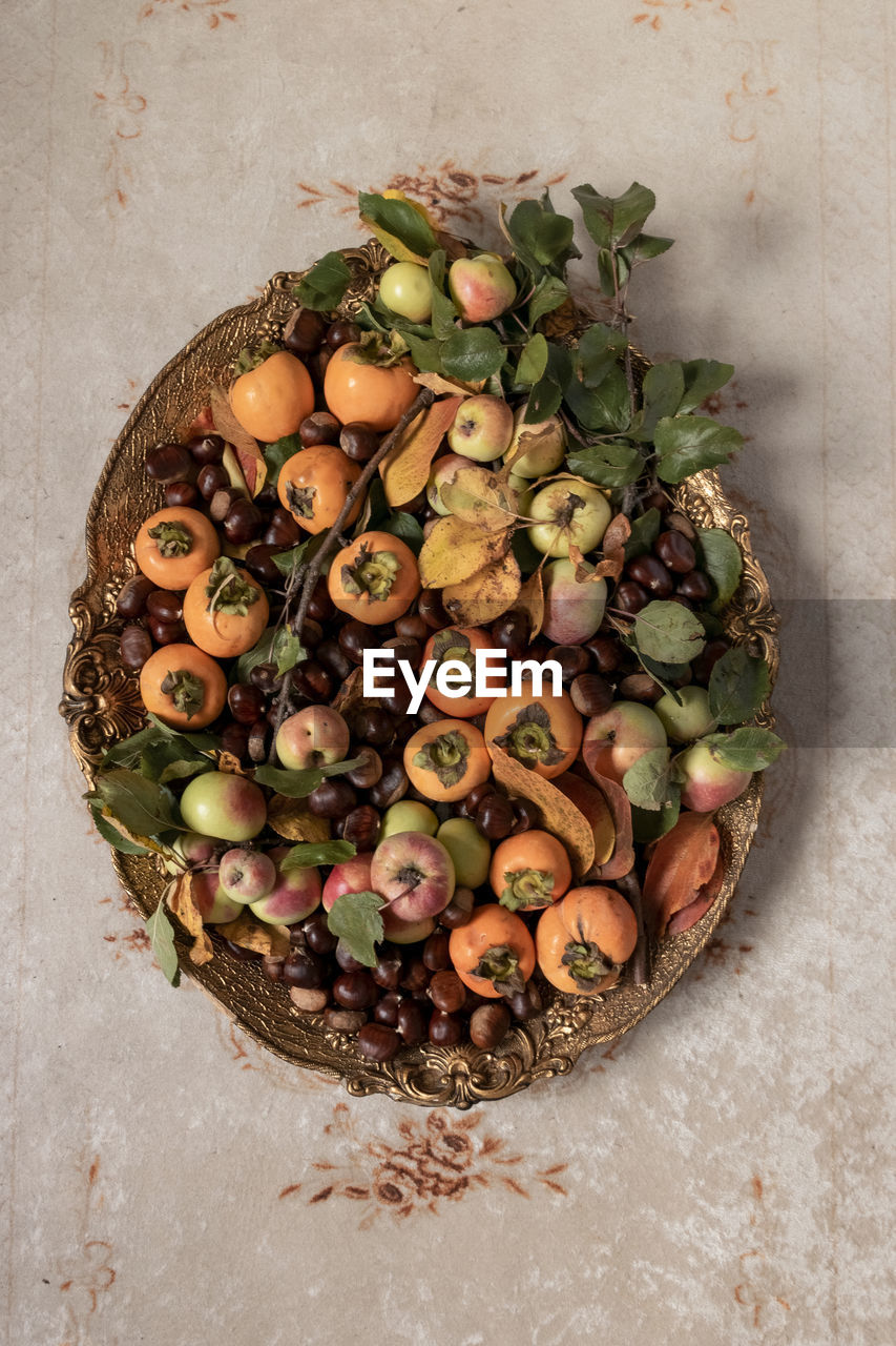 HIGH ANGLE VIEW OF FRUITS IN BASKET ON TABLE